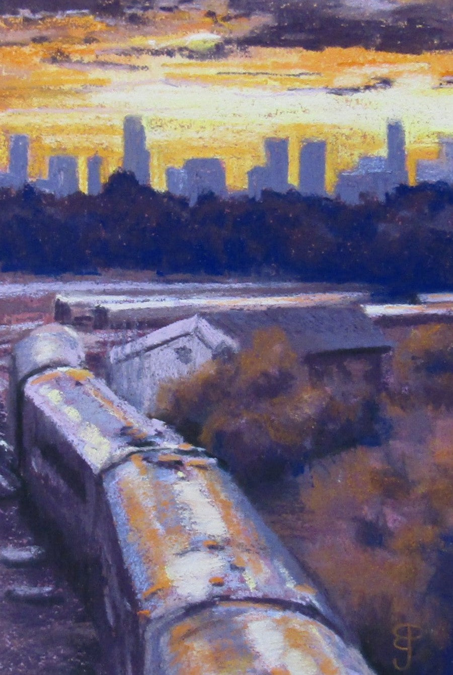 A pastel cityscape painting of a sunset In Birmingham with a train about to enter Tyseley rail depot